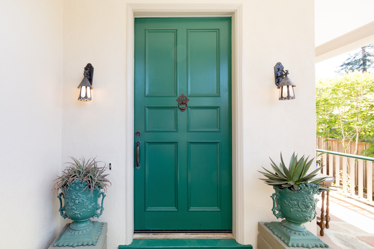 A turquoise exterior door in an El Paso home.